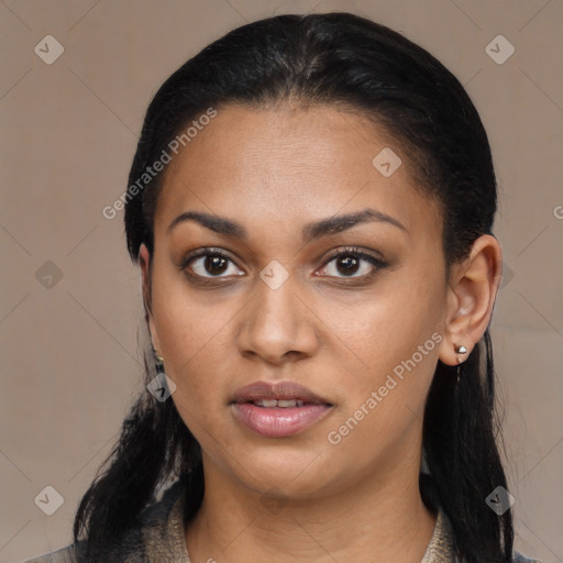 Joyful latino young-adult female with long  black hair and brown eyes