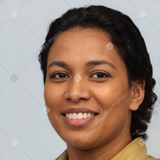 Joyful latino young-adult female with medium  brown hair and brown eyes