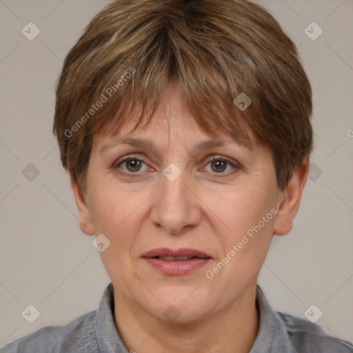 Joyful white adult female with short  brown hair and grey eyes