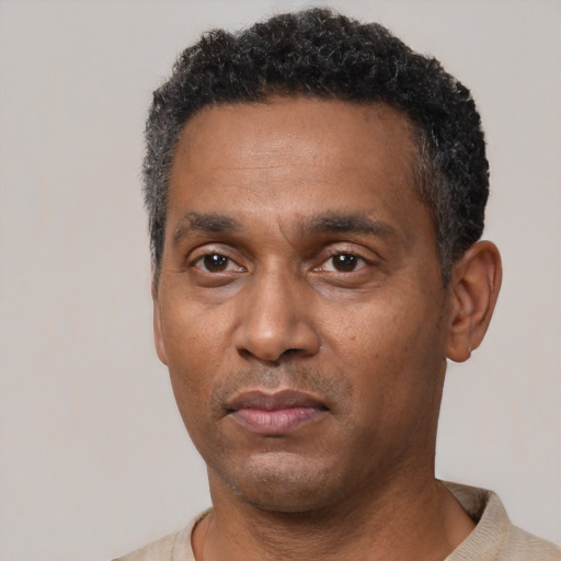 Neutral black adult male with short  black hair and brown eyes