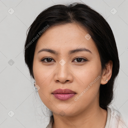 Joyful asian young-adult female with medium  black hair and brown eyes