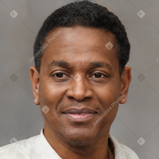 Joyful latino adult male with short  black hair and brown eyes