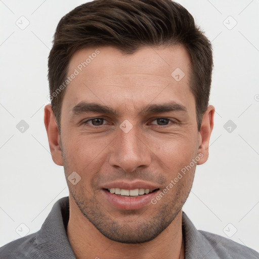 Joyful white young-adult male with short  brown hair and brown eyes