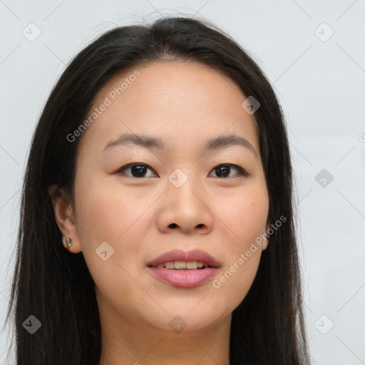 Joyful asian young-adult female with long  brown hair and brown eyes