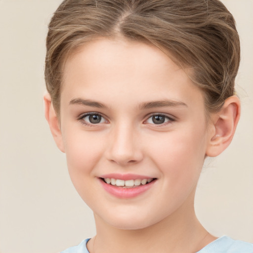 Joyful white child female with short  brown hair and brown eyes