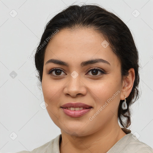 Joyful latino young-adult female with medium  brown hair and brown eyes