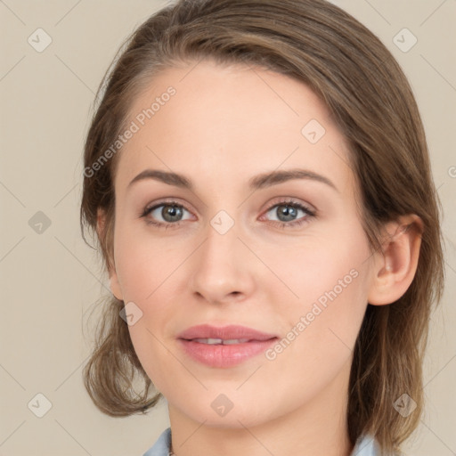 Joyful white young-adult female with medium  brown hair and green eyes