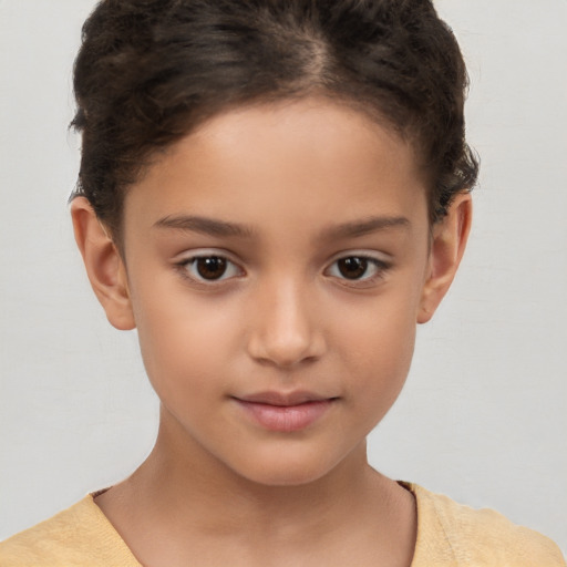 Joyful white child female with short  brown hair and brown eyes