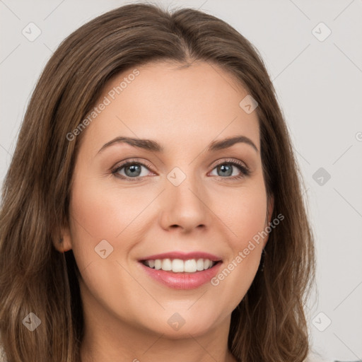 Joyful white young-adult female with long  brown hair and green eyes