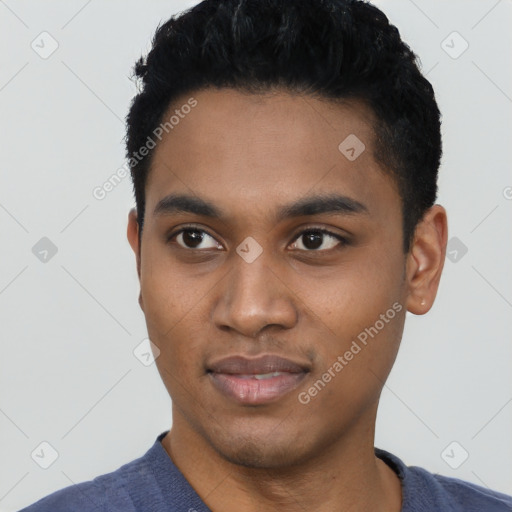 Joyful black young-adult male with short  black hair and brown eyes