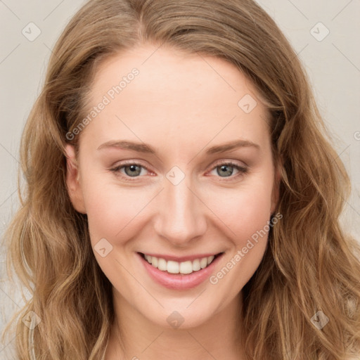 Joyful white young-adult female with long  brown hair and green eyes