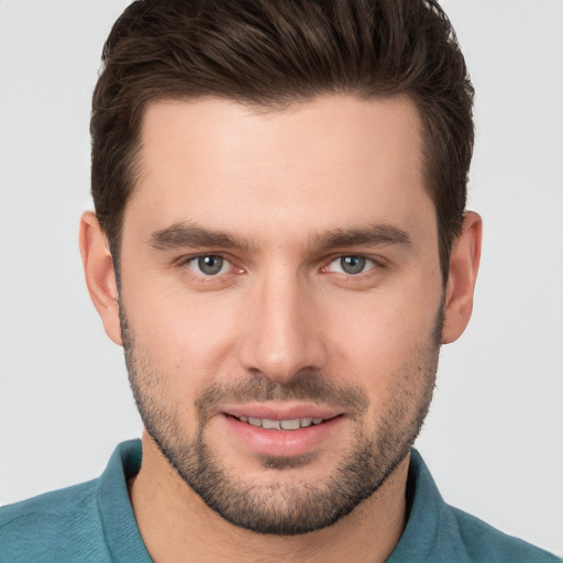 Joyful white young-adult male with short  brown hair and brown eyes