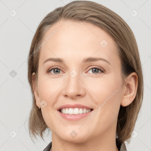 Joyful white young-adult female with medium  brown hair and grey eyes