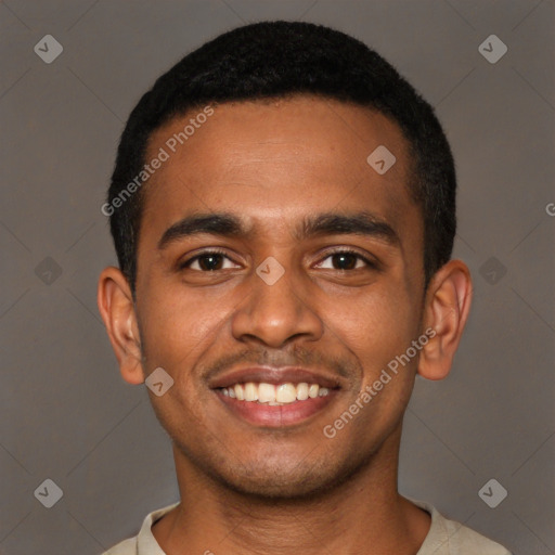 Joyful black young-adult male with short  black hair and brown eyes