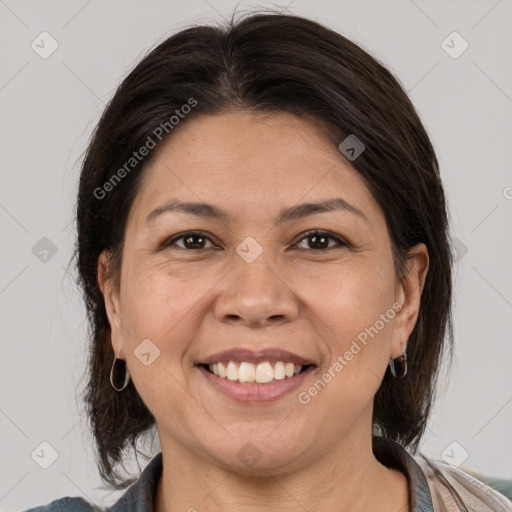 Joyful white adult female with medium  brown hair and brown eyes