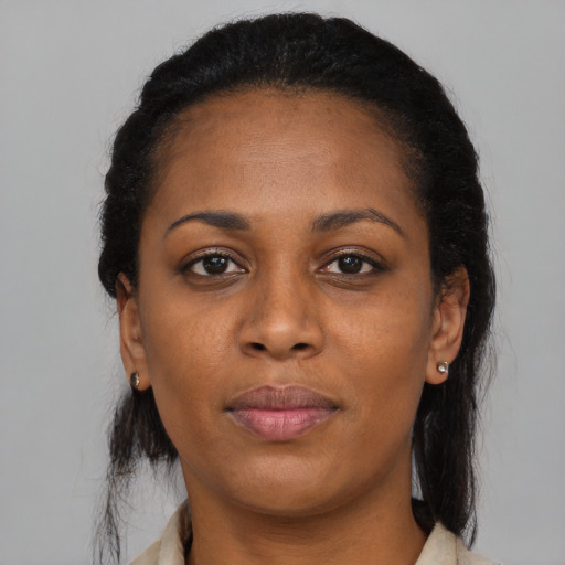 Neutral black adult female with medium  black hair and brown eyes
