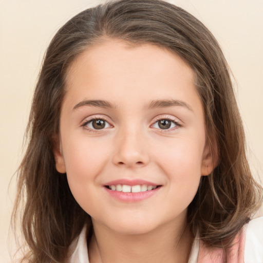 Joyful white child female with long  brown hair and brown eyes