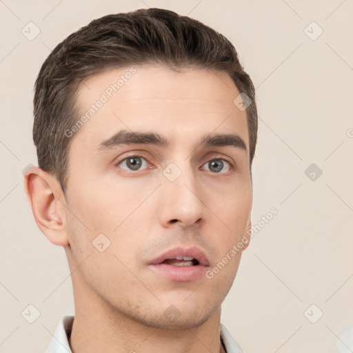 Neutral white young-adult male with short  brown hair and brown eyes