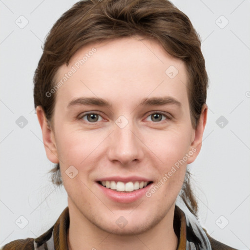 Joyful white young-adult female with short  brown hair and grey eyes