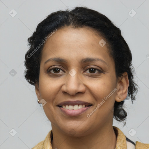 Joyful latino adult female with long  brown hair and brown eyes