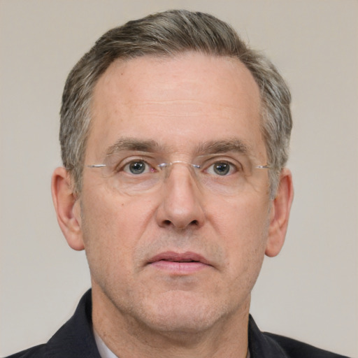 Neutral white middle-aged male with short  gray hair and brown eyes