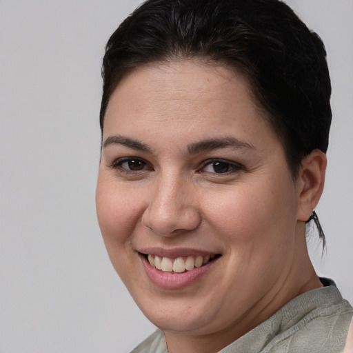 Joyful white young-adult female with short  brown hair and brown eyes