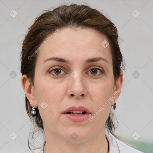 Joyful white adult female with medium  brown hair and grey eyes