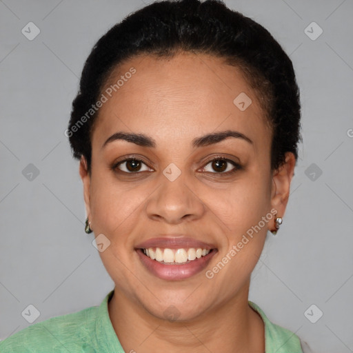 Joyful latino young-adult female with short  black hair and brown eyes