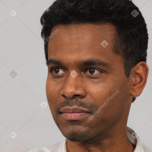 Neutral black young-adult male with short  black hair and brown eyes