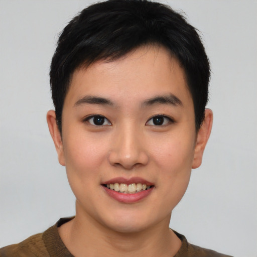 Joyful asian young-adult female with short  black hair and brown eyes