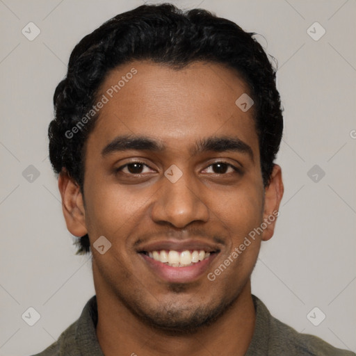 Joyful black young-adult male with short  black hair and brown eyes