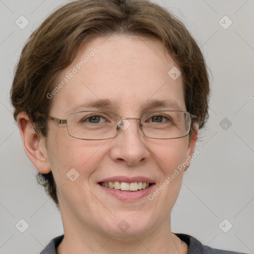 Joyful white adult female with short  brown hair and grey eyes