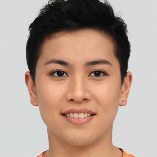 Joyful asian young-adult female with short  black hair and brown eyes