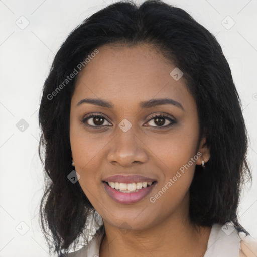 Joyful black young-adult female with long  brown hair and brown eyes