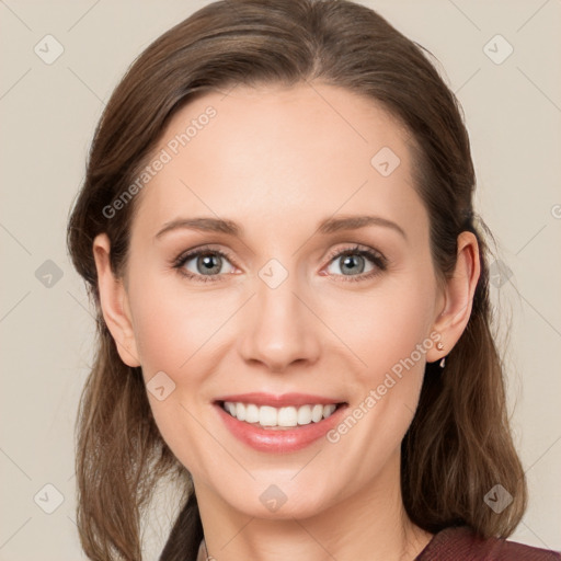 Joyful white young-adult female with medium  brown hair and blue eyes