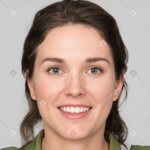 Joyful white young-adult female with medium  brown hair and green eyes