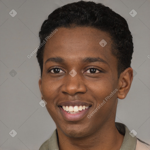 Joyful black young-adult male with short  black hair and brown eyes