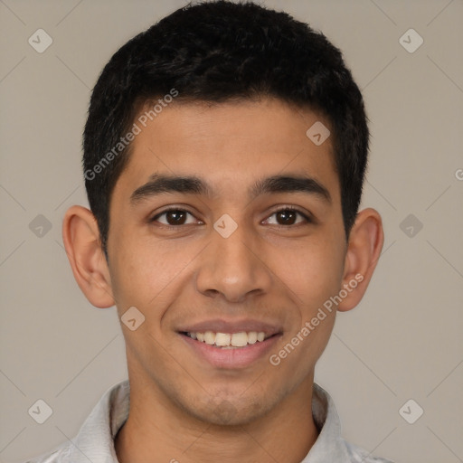 Joyful latino young-adult male with short  black hair and brown eyes