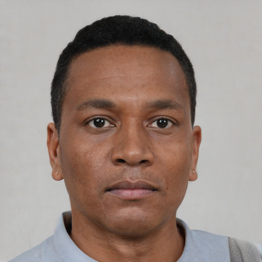 Neutral black young-adult male with short  black hair and brown eyes
