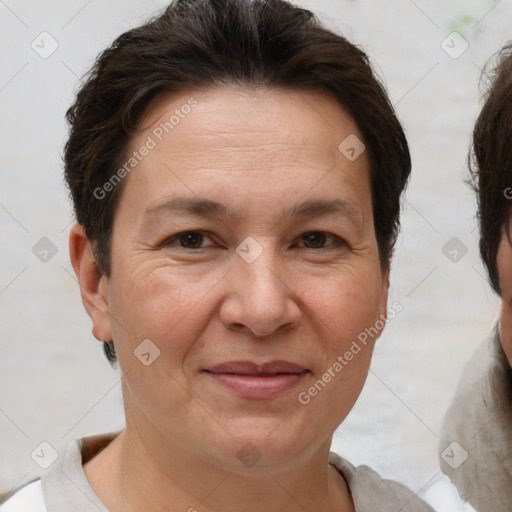 Joyful white adult female with short  brown hair and brown eyes