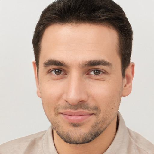 Joyful white young-adult male with short  brown hair and brown eyes