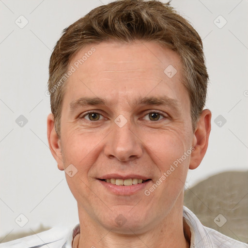 Joyful white adult male with short  brown hair and grey eyes