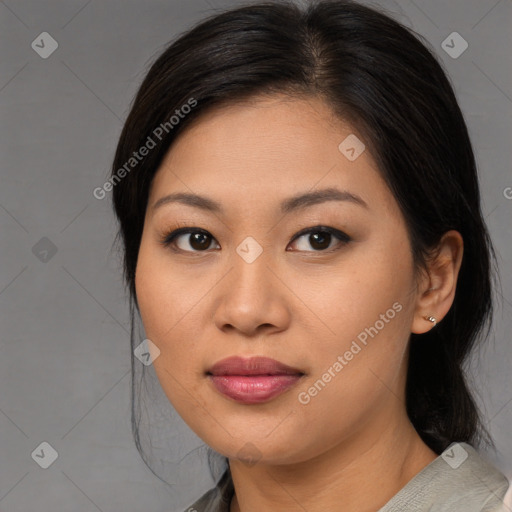 Joyful asian young-adult female with medium  brown hair and brown eyes