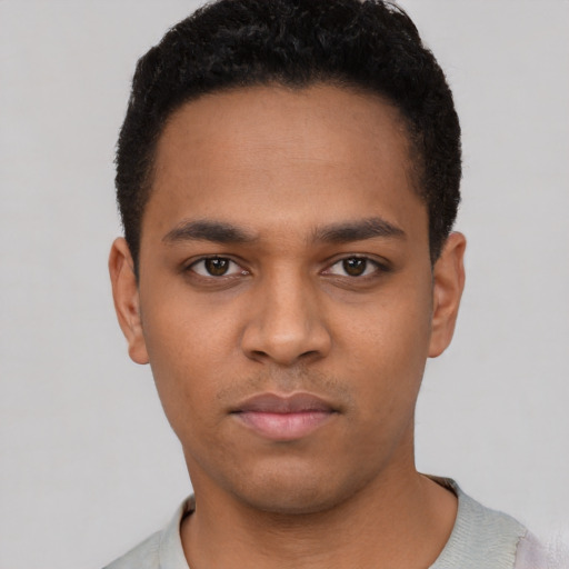 Neutral black young-adult male with short  black hair and brown eyes
