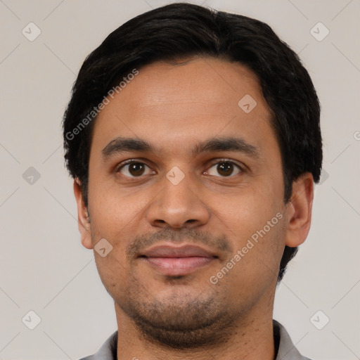 Joyful latino young-adult male with short  black hair and brown eyes