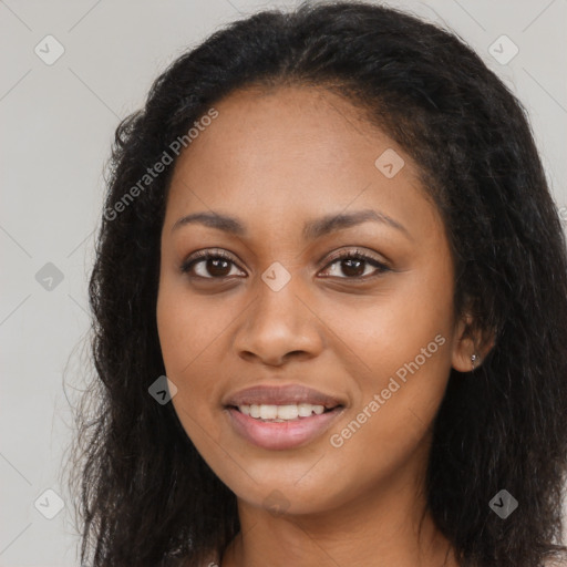 Joyful black young-adult female with long  brown hair and brown eyes