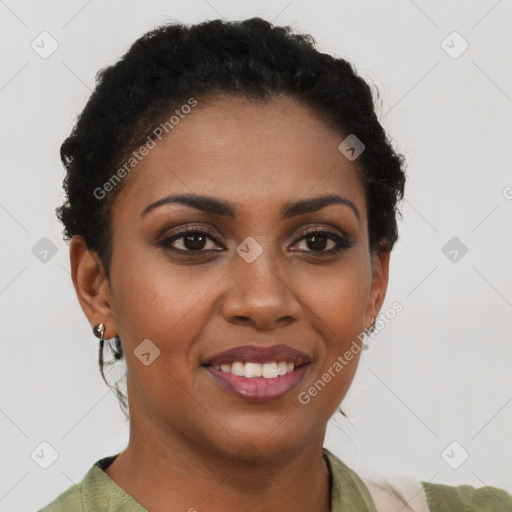 Joyful black young-adult female with short  brown hair and brown eyes