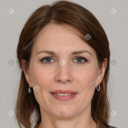 Joyful white adult female with medium  brown hair and grey eyes