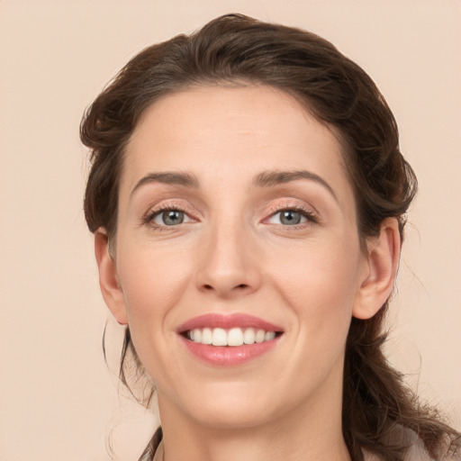 Joyful white young-adult female with long  brown hair and grey eyes