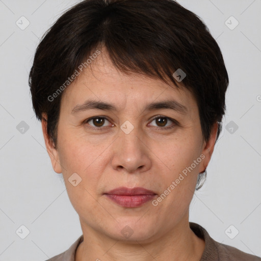 Joyful white adult female with short  brown hair and brown eyes